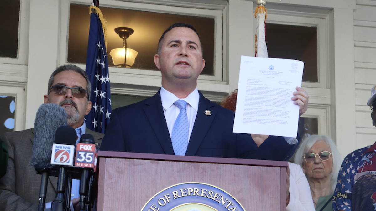 Soto holding up sign