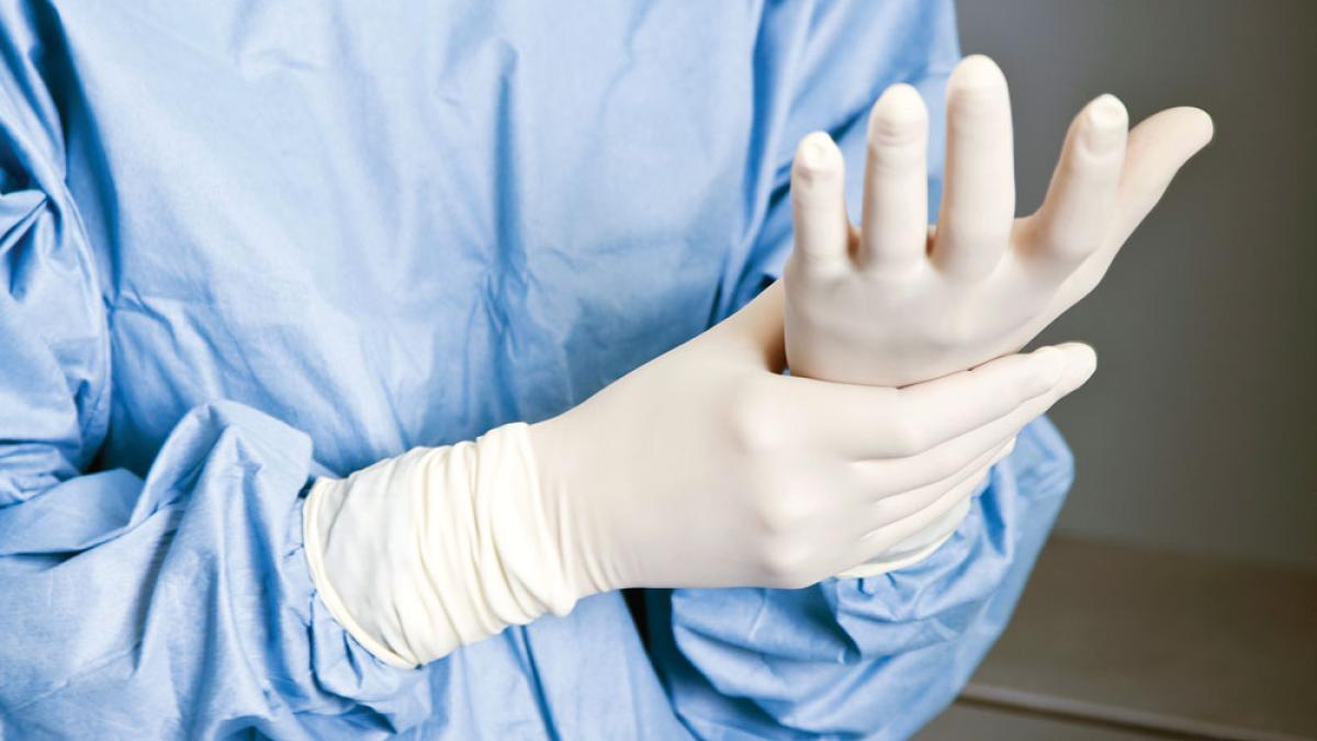 a nurse with rubber gloves