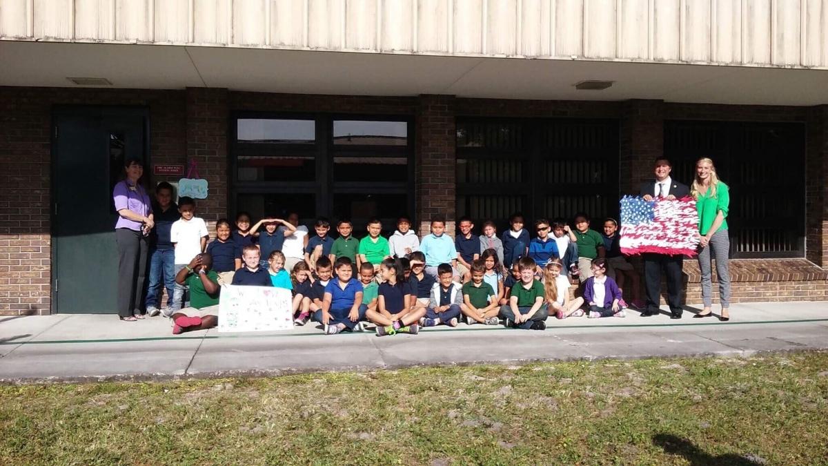 Closeup shot of a young man writing on a note pad
