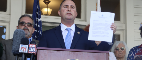 Soto holding up sign