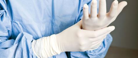 a nurse with rubber gloves