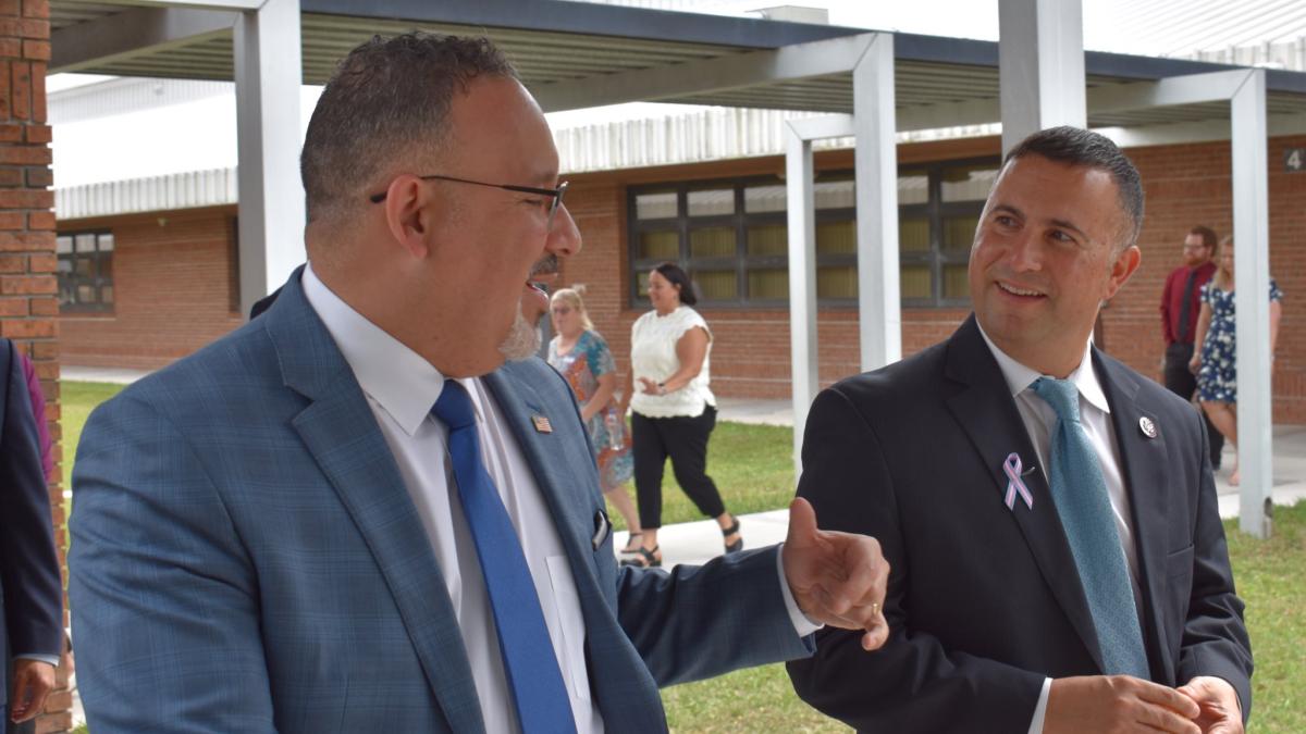 Rep. Darren Soto and Secretary Miguel Cardona talking