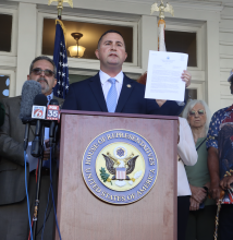 Soto holding up sign